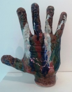 Hand with Faces by Geoff Calabrese